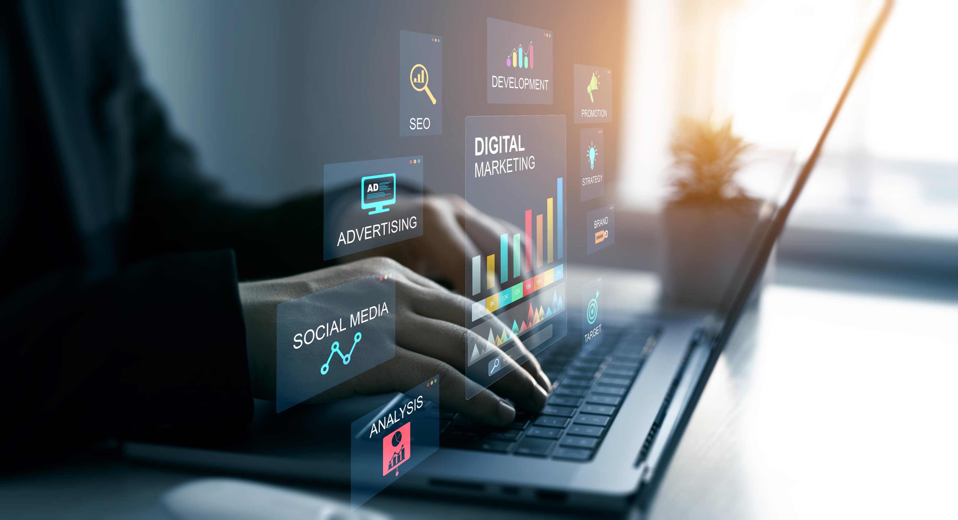 Hands on a laptop with website, social media and digital marketing panels overlaid